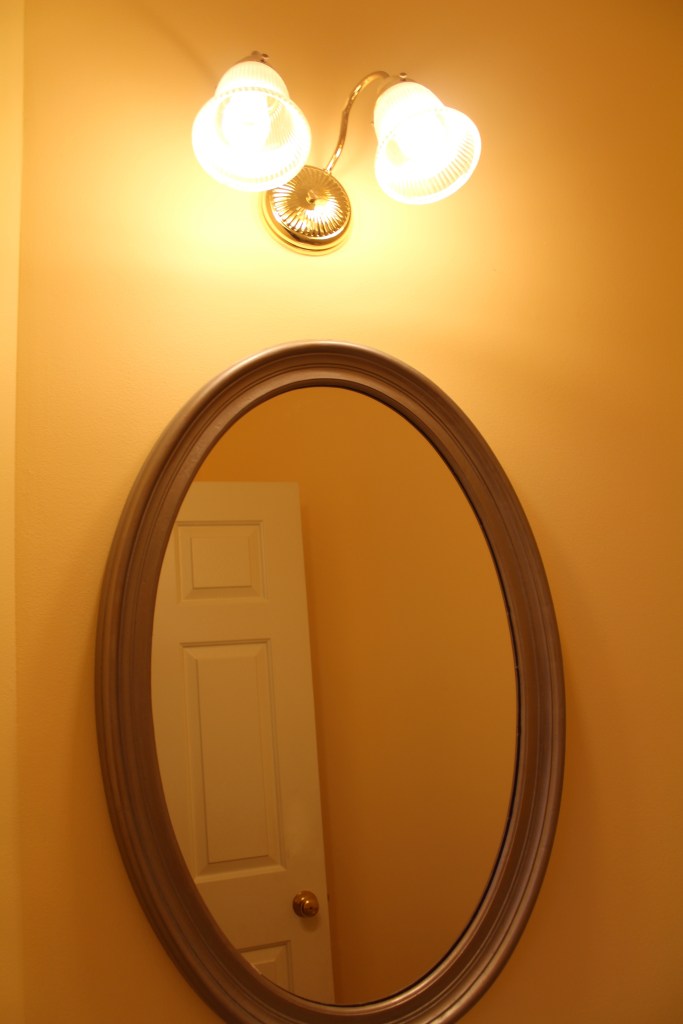 This gold light fixture had to go!